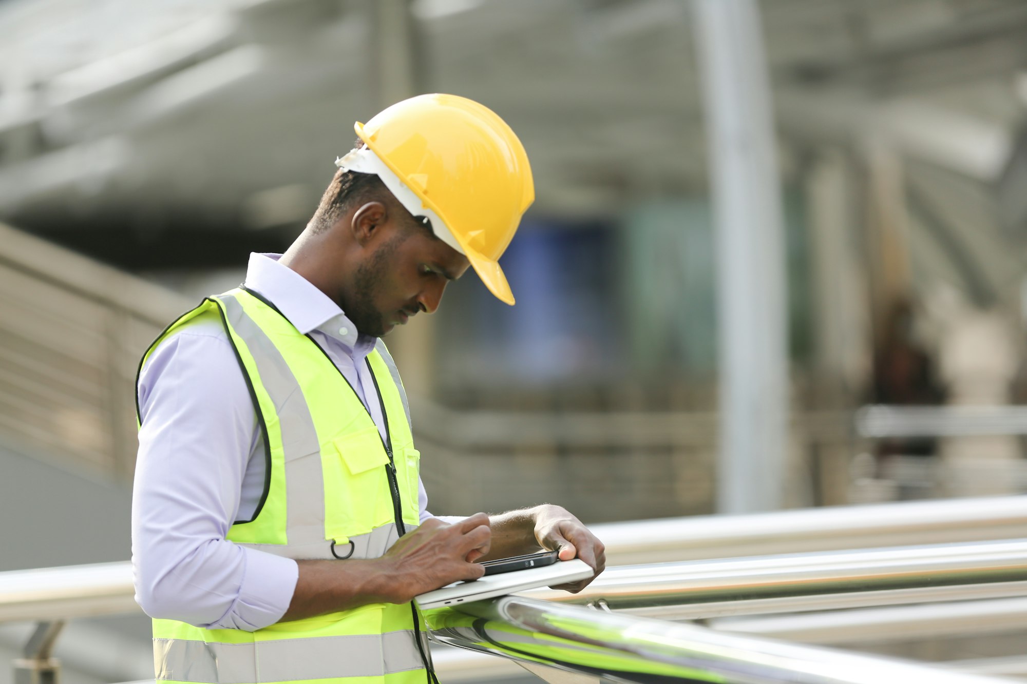 African young architect concentrating on his work